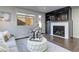 Living room with fireplace, large TV, and access to backyard at 2311 Decatur St, Denver, CO 80211