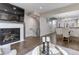 Open concept living area with a fireplace and adjacent dining area at 2311 Decatur St, Denver, CO 80211