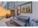 Private patio with table, benches, and string lights at 2311 Decatur St, Denver, CO 80211