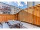 Outdoor patio area with string lights and wood fence at 2311 Decatur St, Denver, CO 80211
