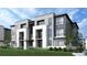 Modern townhome building with attached garages at 11930 Soprano Cir # 302, Lone Tree, CO 80134