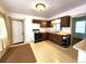Kitchen with wood cabinets, gas range and linoleum flooring at 2752 Miner St, Idaho Springs, CO 80452