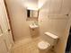 Small bathroom with single sink vanity, toilet and wall-mounted mirror at 2752 Miner St, Idaho Springs, CO 80452