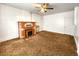 Living room with ceiling fan, hardwood floors and a brick fireplace at 2752 Miner St, Idaho Springs, CO 80452