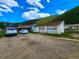 Yellow garage with two garage doors and adjacent building at 2752 Miner St, Idaho Springs, CO 80452
