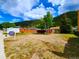 Property with vacant lot and mountain backdrop at 2752 Miner St, Idaho Springs, CO 80452