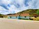Blue and yellow houses with mountain backdrop at 2752 Miner St, Idaho Springs, CO 80452