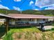 Light blue house with a covered porch and a grill at 2752 Miner St, Idaho Springs, CO 80452