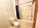 Bathroom with shower/tub combo and wood-paneled walls at 2752 Miner St, Idaho Springs, CO 80452