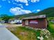 Rustic brown commercial building with a sign for sale at 2752 Miner St, Idaho Springs, CO 80452
