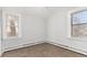 Bright bedroom with two windows and carpeted floor at 367 S Jasmine St, Denver, CO 80224