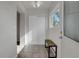 Bright entryway with tiled floor and bench at 6316 Tennyson St, Arvada, CO 80003