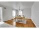 Dining room with hardwood floors and light-colored table at 6316 Tennyson St, Arvada, CO 80003