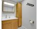 Basement bathroom with vanity and wood cabinet at 6316 Tennyson St, Arvada, CO 80003