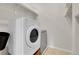 Laundry room with a washer and dryer and extra shelving at 6316 Tennyson St, Arvada, CO 80003