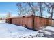 Long wooden garage with multiple entry points at 6316 Tennyson St, Arvada, CO 80003