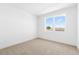 Bright bedroom with two large windows and neutral carpet at 14289 W Currant St, Broomfield, CO 80020