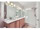 Elegant bathroom with double sinks and a walk-in shower at 2700 E Cherry Creek South Dr # 313, Denver, CO 80209