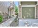 Attached garage with a spacious driveway and convenient side walkway at 1231 Carlyle Park Cir, Highlands Ranch, CO 80129