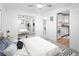 Bright bedroom with a queen-size bed and access to the kitchen at 1 S Pennsylvania St # 104, Denver, CO 80209