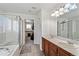 Main bathroom boasts double sinks and a walk-in shower at 6650 Sunburst Ave, Firestone, CO 80504