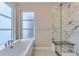 Modern bathroom with a large soaking tub and marble shower at 1765 Peak Loop, Broomfield, CO 80023