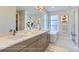 Elegant bathroom with double vanity, large mirror, and soaking tub at 1765 Peak Loop, Broomfield, CO 80023