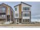 Modern two-story home with a stylish facade and attached garage at 1765 Peak Loop, Broomfield, CO 80023