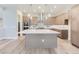 Modern kitchen features a large island and stainless steel appliances at 1765 Peak Loop, Broomfield, CO 80023