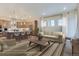 Open concept kitchen and living area with large island at 1765 Peak Loop, Broomfield, CO 80023