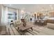 Open concept kitchen and living area with large island at 1765 Peak Loop, Broomfield, CO 80023