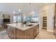 Modern kitchen island with white quartz countertop and stainless steel appliances at 1765 Peak Loop, Broomfield, CO 80023