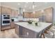 Modern kitchen with large island and stainless steel appliances at 1765 Peak Loop, Broomfield, CO 80023