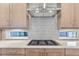 Modern kitchen features gas cooktop and contemporary backsplash at 1765 Peak Loop, Broomfield, CO 80023