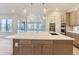 Gourmet kitchen with expansive island and high-end finishes at 1765 Peak Loop, Broomfield, CO 80023