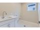Convenient laundry room with sink and cabinets at 1765 Peak Loop, Broomfield, CO 80023