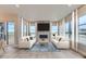 Bright living room with two sofas, a coffee table, and a fireplace at 1765 Peak Loop, Broomfield, CO 80023