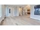 Open living room with hardwood floors and sliding barn doors at 1765 Peak Loop, Broomfield, CO 80023