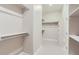 Large walk-in closet with custom shelving and rods at 1765 Peak Loop, Broomfield, CO 80023