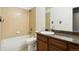 Simple bathroom with single sink, shower/tub combo, and granite vanity at 4947 S Wadsworth Blvd, Littleton, CO 80123