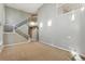 Spacious living room with high ceilings and a staircase at 4947 S Wadsworth Blvd, Littleton, CO 80123