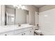 Clean bathroom with a white vanity, bathtub, and tiled shower at 16870 Mckay Dr, Mead, CO 80542