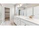 Double vanity bathroom with a large mirror and walk-in shower at 16870 Mckay Dr, Mead, CO 80542