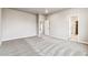 Spacious carpeted bedroom with neutral walls and ample natural light at 16870 Mckay Dr, Mead, CO 80542