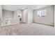 Upstairs bedroom with grey carpet and neutral walls at 16870 Mckay Dr, Mead, CO 80542