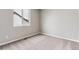 Bright bedroom featuring neutral walls and carpeted floors at 16870 Mckay Dr, Mead, CO 80542