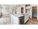 Modern kitchen with white cabinets, stainless steel appliances, and an island at 16870 Mckay Dr, Mead, CO 80542