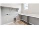 Laundry room with built-in shelving and a folding counter at 16870 Mckay Dr, Mead, CO 80542