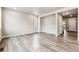 Spacious living room with wood-look floors and an open floor plan at 16870 Mckay Dr, Mead, CO 80542