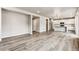 Open concept living area with hardwood floors and kitchen at 16870 Mckay Dr, Mead, CO 80542